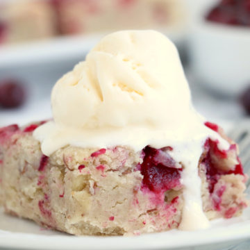 Easy Cranberry Cake - An easy and delicious cake bursting with tart cranberries. Top with vanilla ice cream and enjoy!