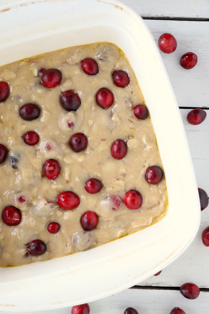 Easy Cranberry Cake - An easy and delicious cake bursting with tart cranberries. Top with vanilla ice cream and enjoy! 