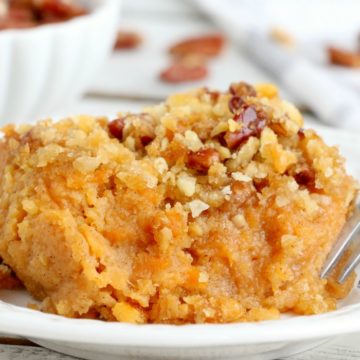 Easy Sweet Potato Casserole - An easy and delicious casserole that comes together with no scrubbing, boiling or baking the sweet potatoes! Topped with a sweet, salty and crunchy streusel, your guests will devour this simple and tasty side dish! 