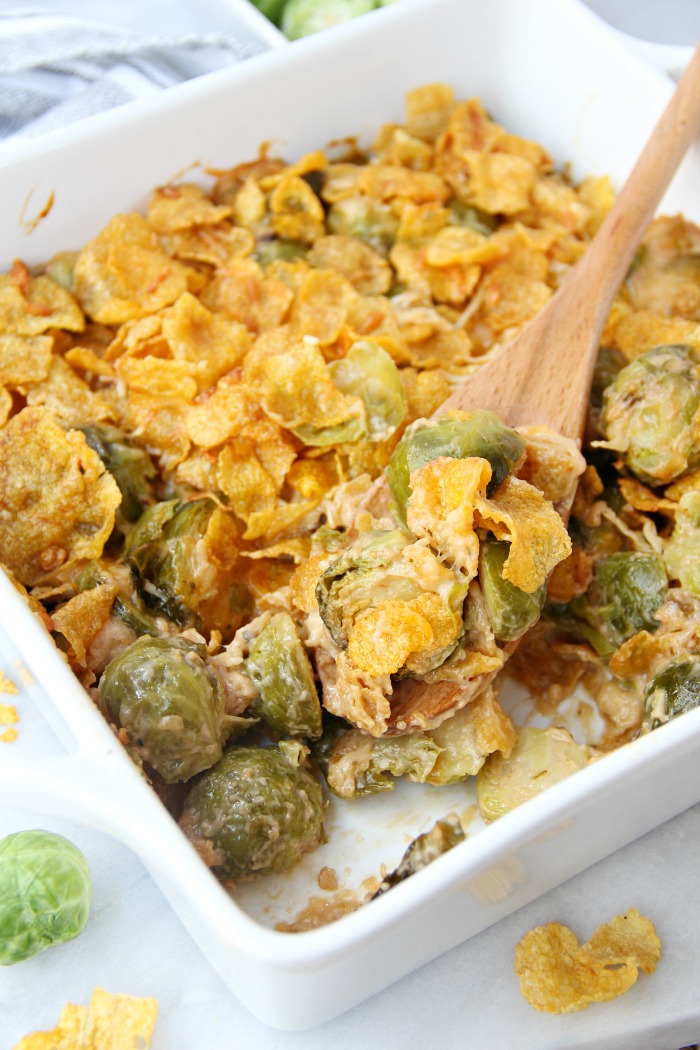 Scooping Brussels sprouts out of pan