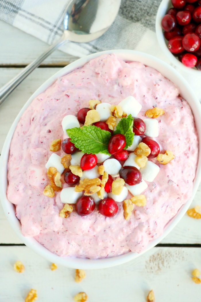 Cranberry Fluff - Tangy, chilled cranberries and sweet crushed pineapple, folded into marshmallow-filled whipped cream makes this side dish a family favorite! 