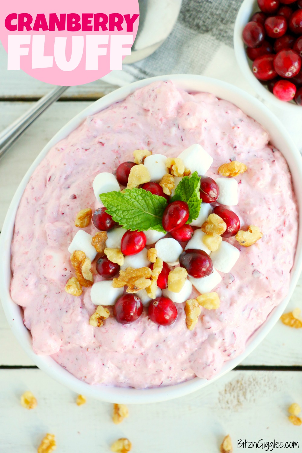 Cranberry Fluff - Tangy, chilled cranberries and sweet crushed pineapple, folded into marshmallow-filled whipped cream makes this side dish a family favorite!