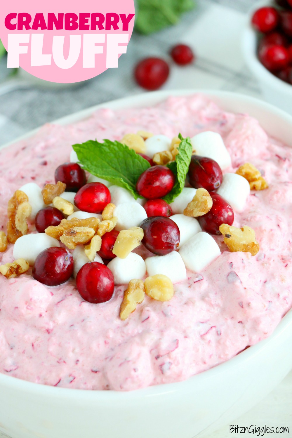 Cranberry Fluff - Tangy, chilled cranberries and sweet crushed pineapple, folded into marshmallow-filled whipped cream makes this side dish a family favorite!