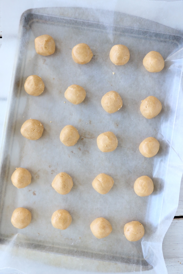 peanut butter balls on cookie sheet