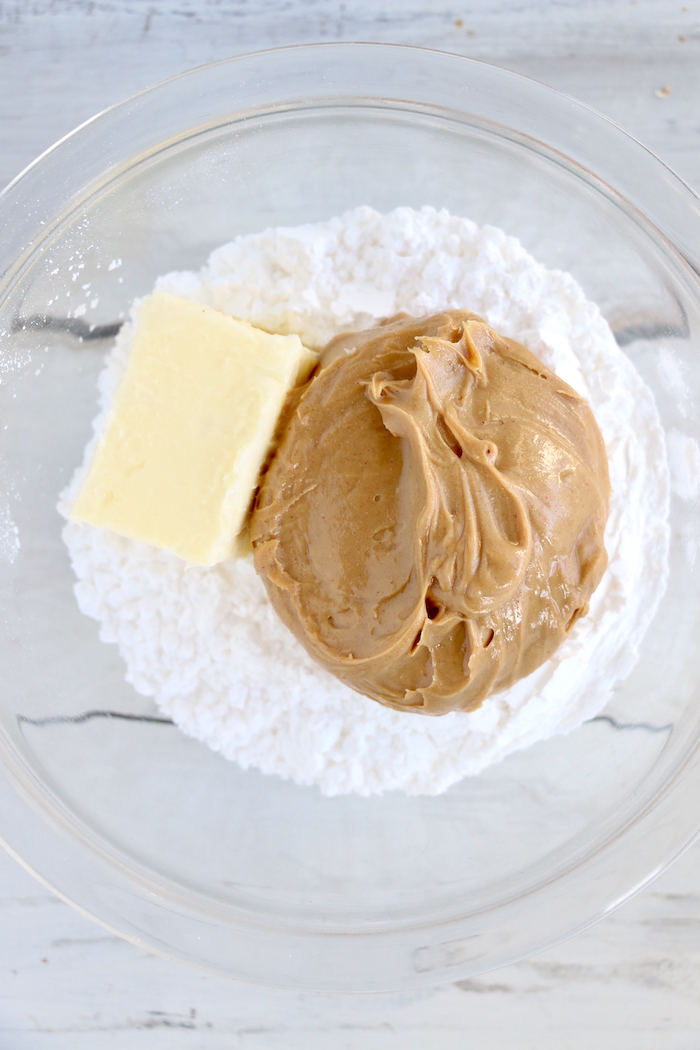 Butter, powdered sugar and peanut butter in a bowl