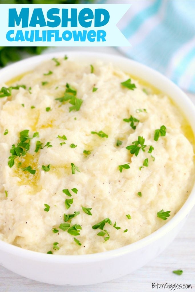 mashed cauliflower in a bowl with butter and parsley