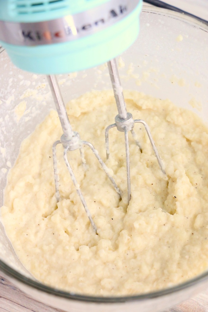 hand mixing cauliflower mash