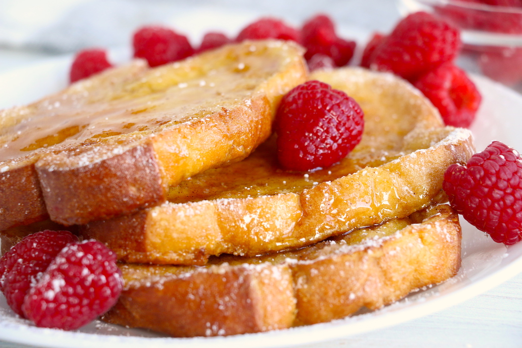 French toast with maple syrup and raspberries