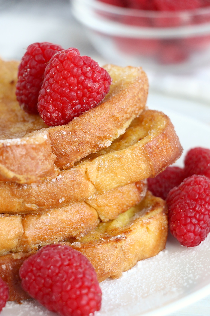 Stack of French toast with raspberries