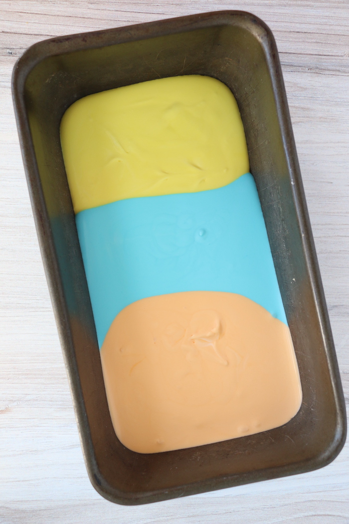 yellow, blue and orange ice cream in loaf pan