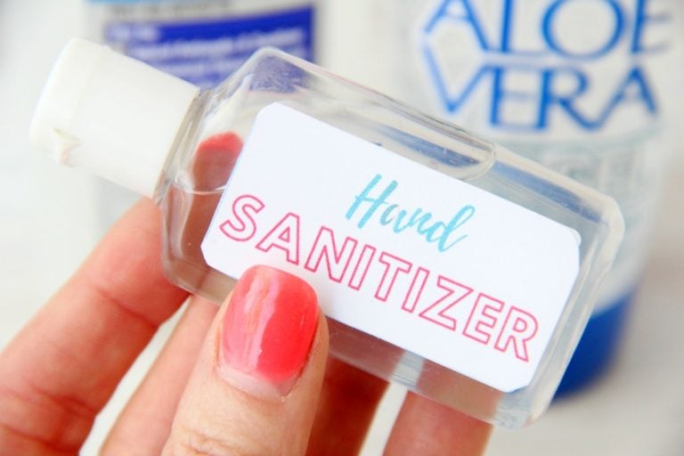 hand holding a bottle of homemade hand sanitizer