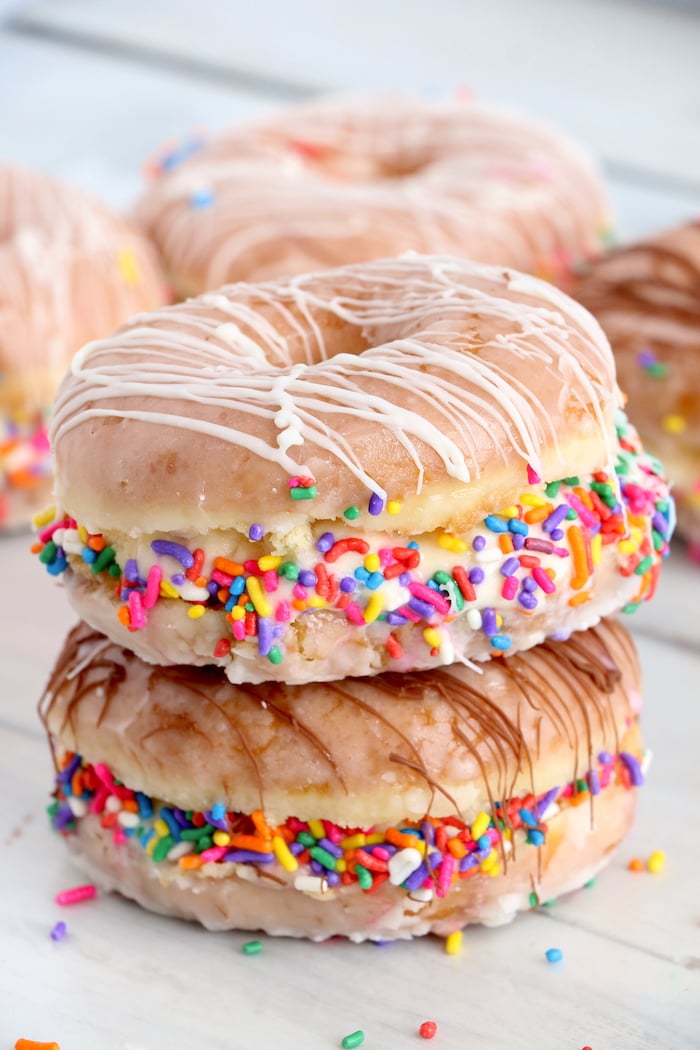 Stack of two donut ice cream sandwiches with sprinkles