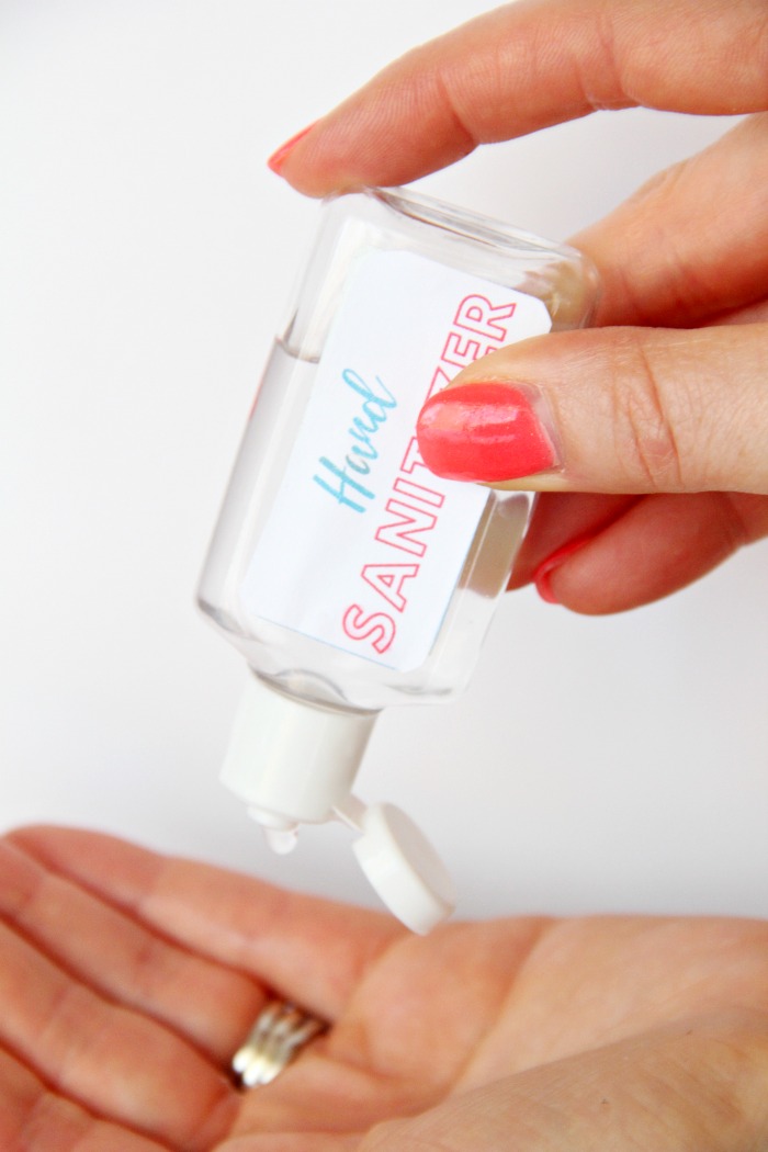 Squeezing a bottle of hand sanitizer
