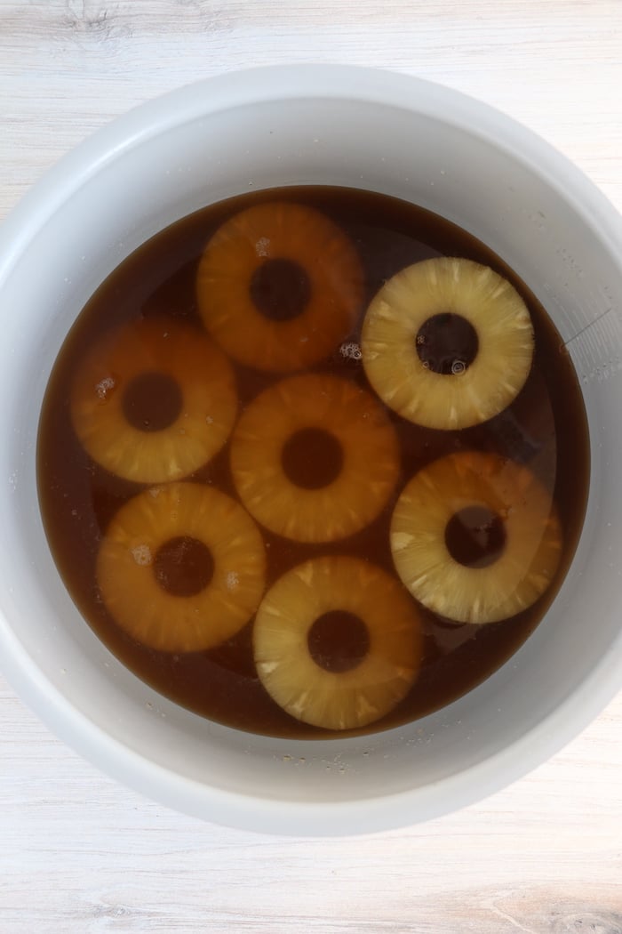 Pineapple slices in cola in Ninja Foodi cooking pot