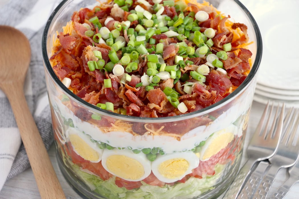 Layered salad in plastic cups. Perfect for picnics