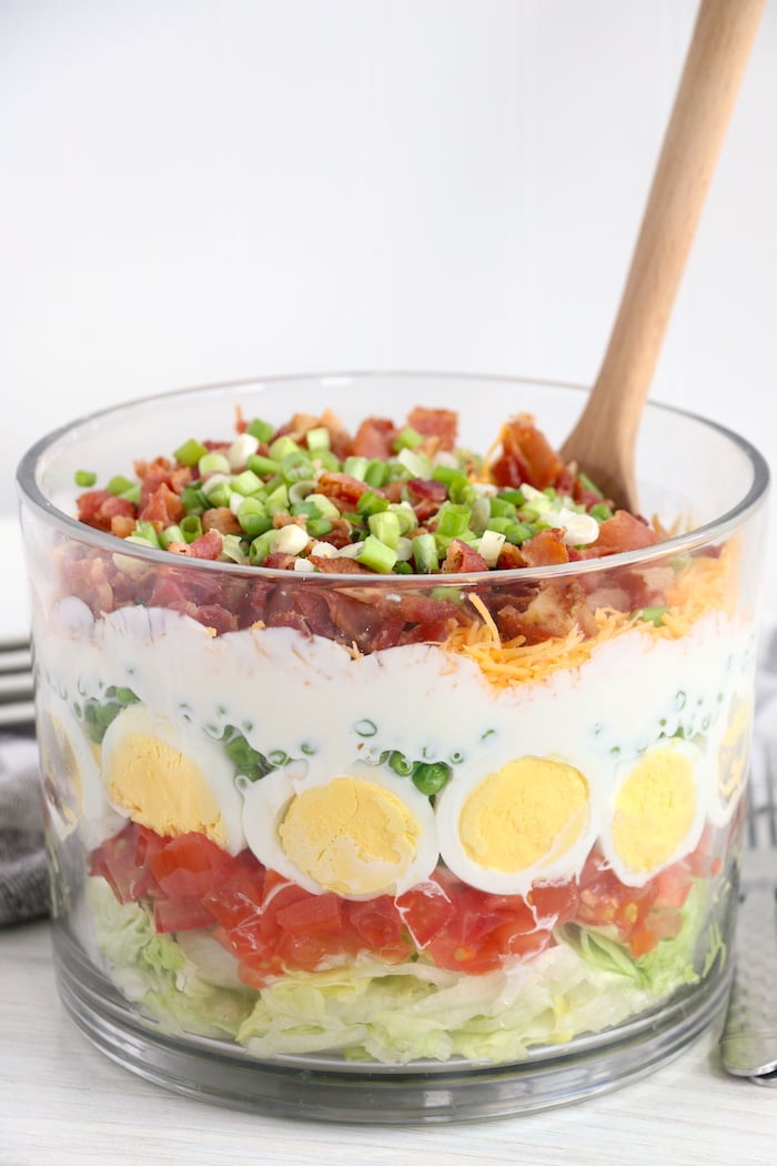 seven layer salad with spoon