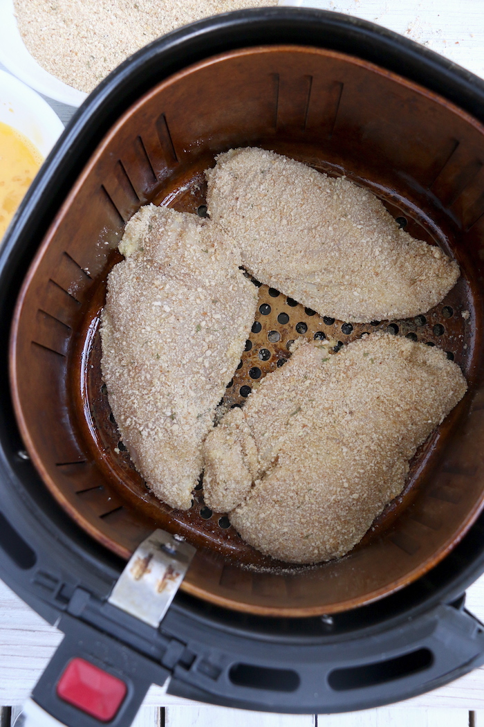 Breaded chicken in air fryer basket
