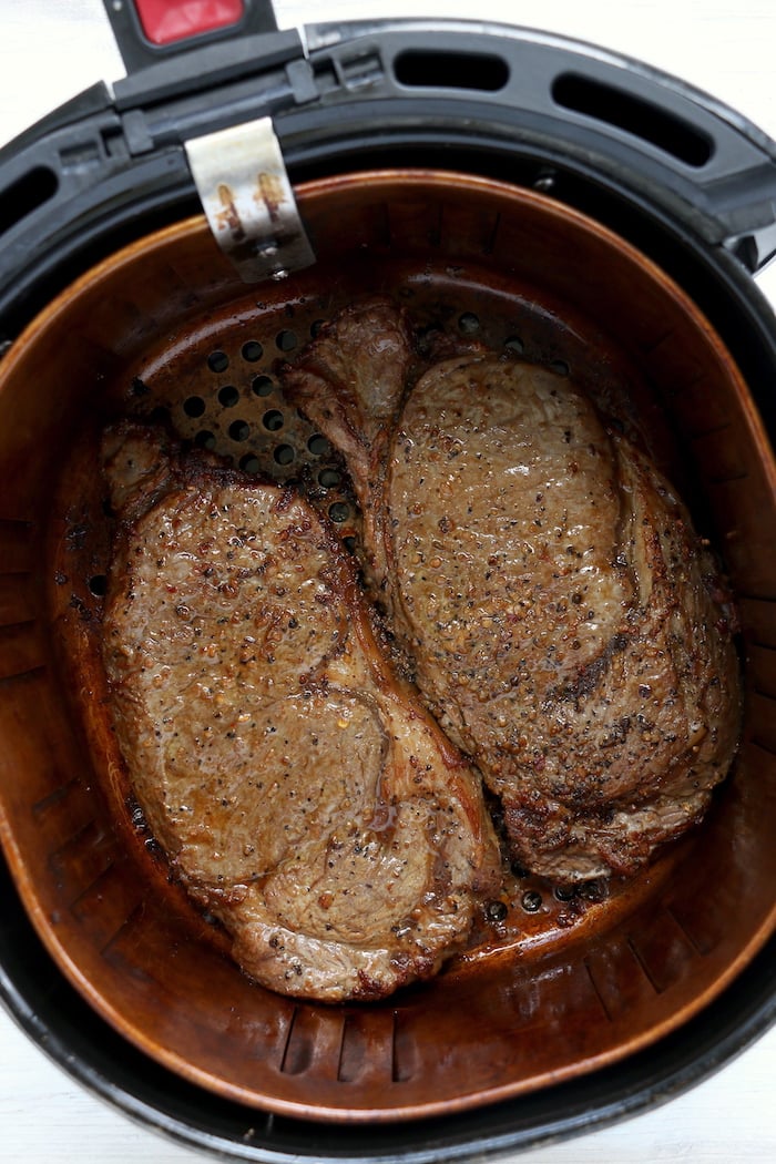 cooked steaks in air fryer basket