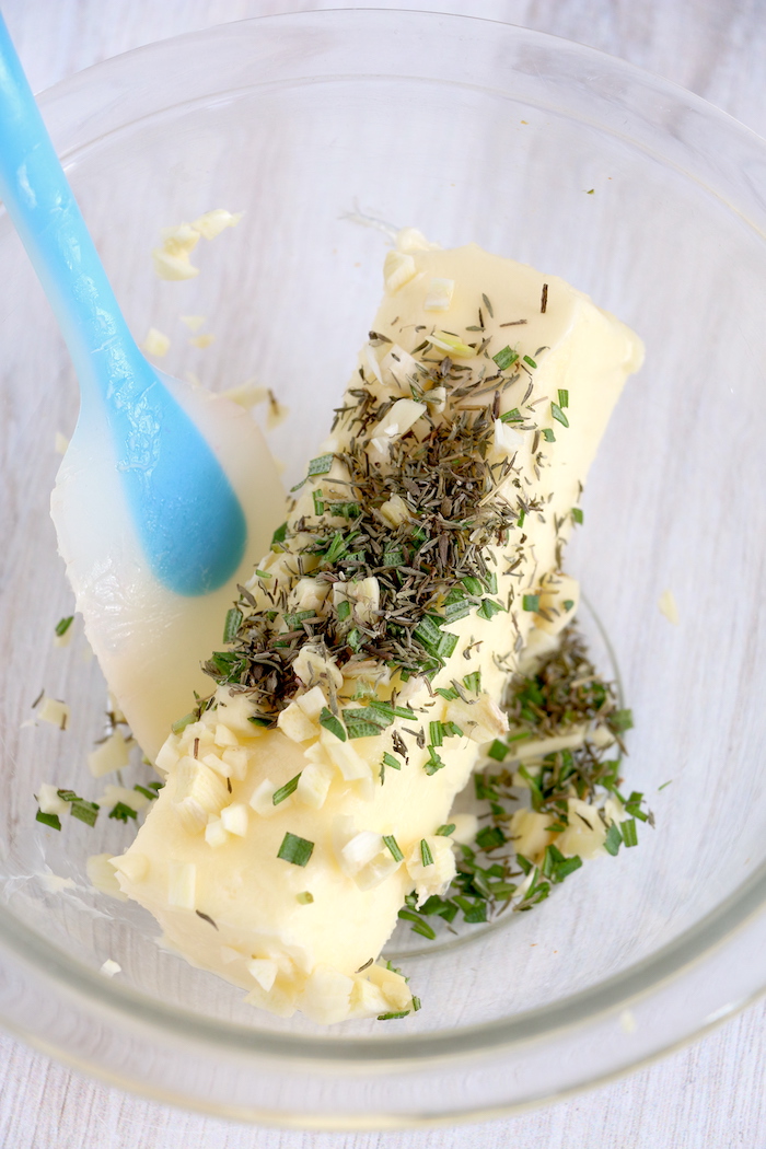Mixing ingredients for garlic herb butter