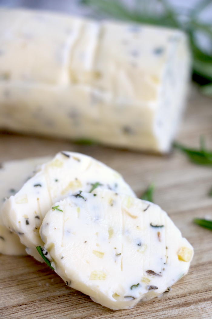 slices of garlic herb butter from a log