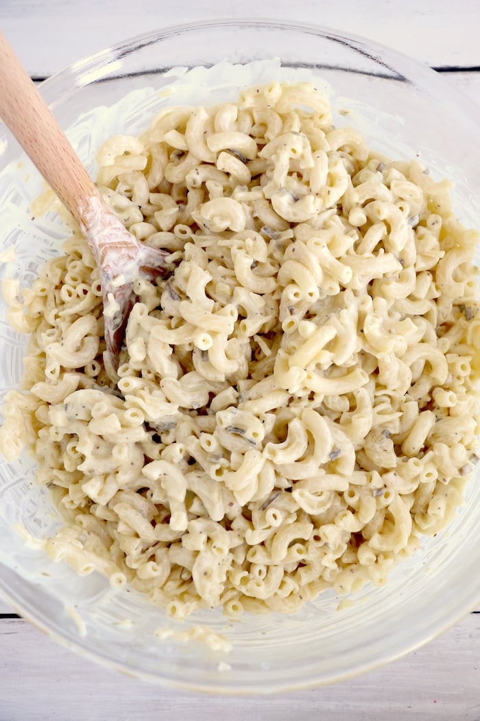 Mixing pasta with dressing