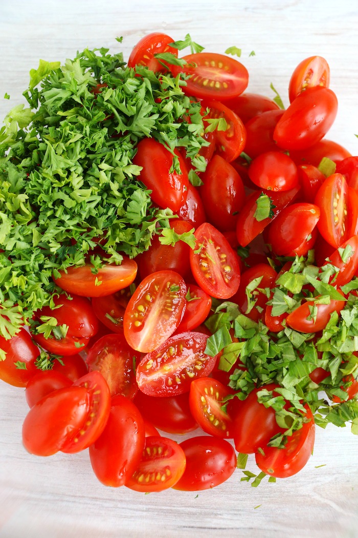 Sliced tomatoes, basil and parsley