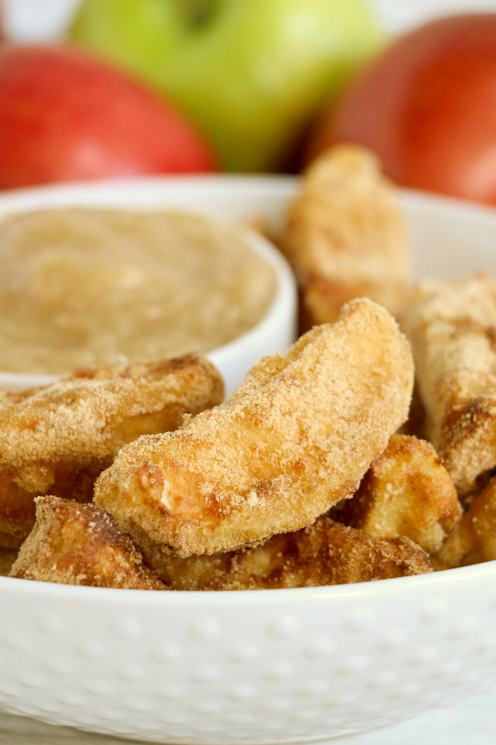 Bowl of air fryer apple fries with caramel dip