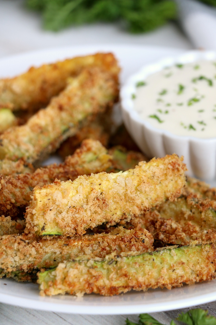 zucchini fries on plate with dip