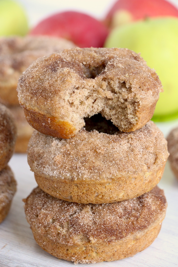 Stack of baked apple donuts with bite out