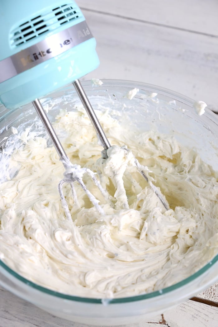 whipping up dressing for a veggie pizza