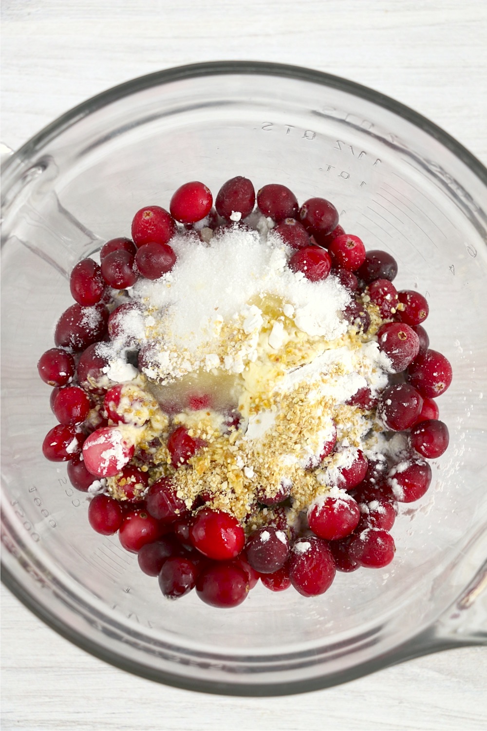 cranberries and sugar in glass bowl