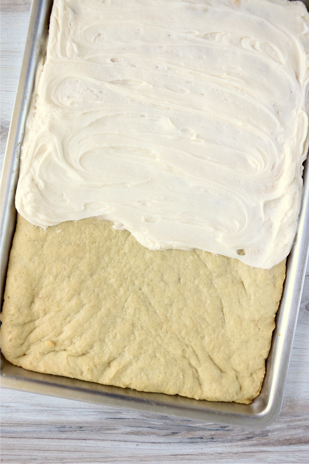 Frosting cooled cake bars