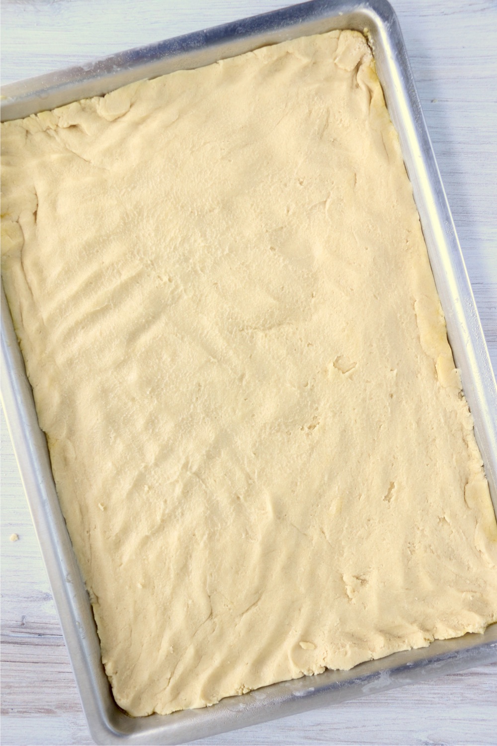 Spreading dough in jelly roll pan