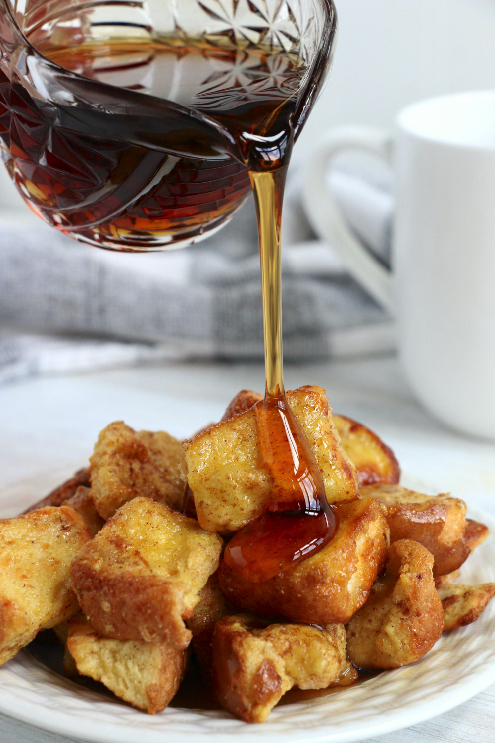 pouring syrup onto French Toast Bites