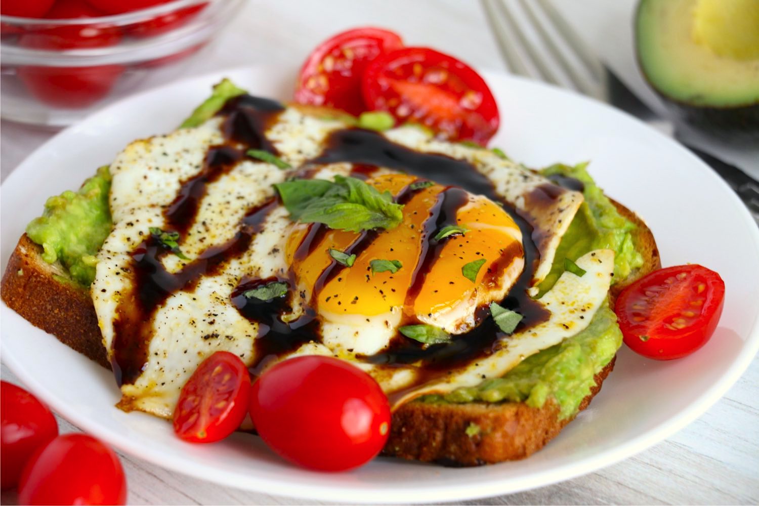 Egg on avocado toast with cherry tomatoes