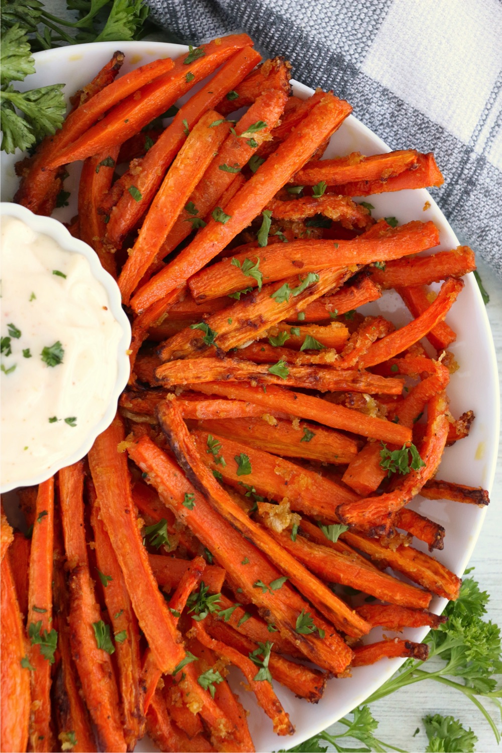 plate of fanned out carrot fries with dipping sauce