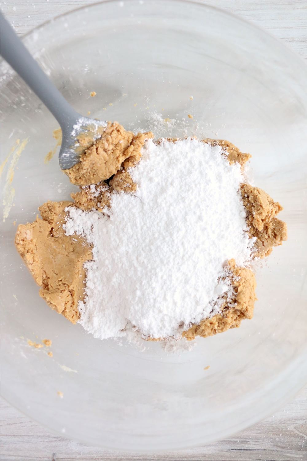 Adding powdered sugar to dough mixture