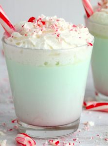 Glasses of mint hot chocolate with peppermint sticks