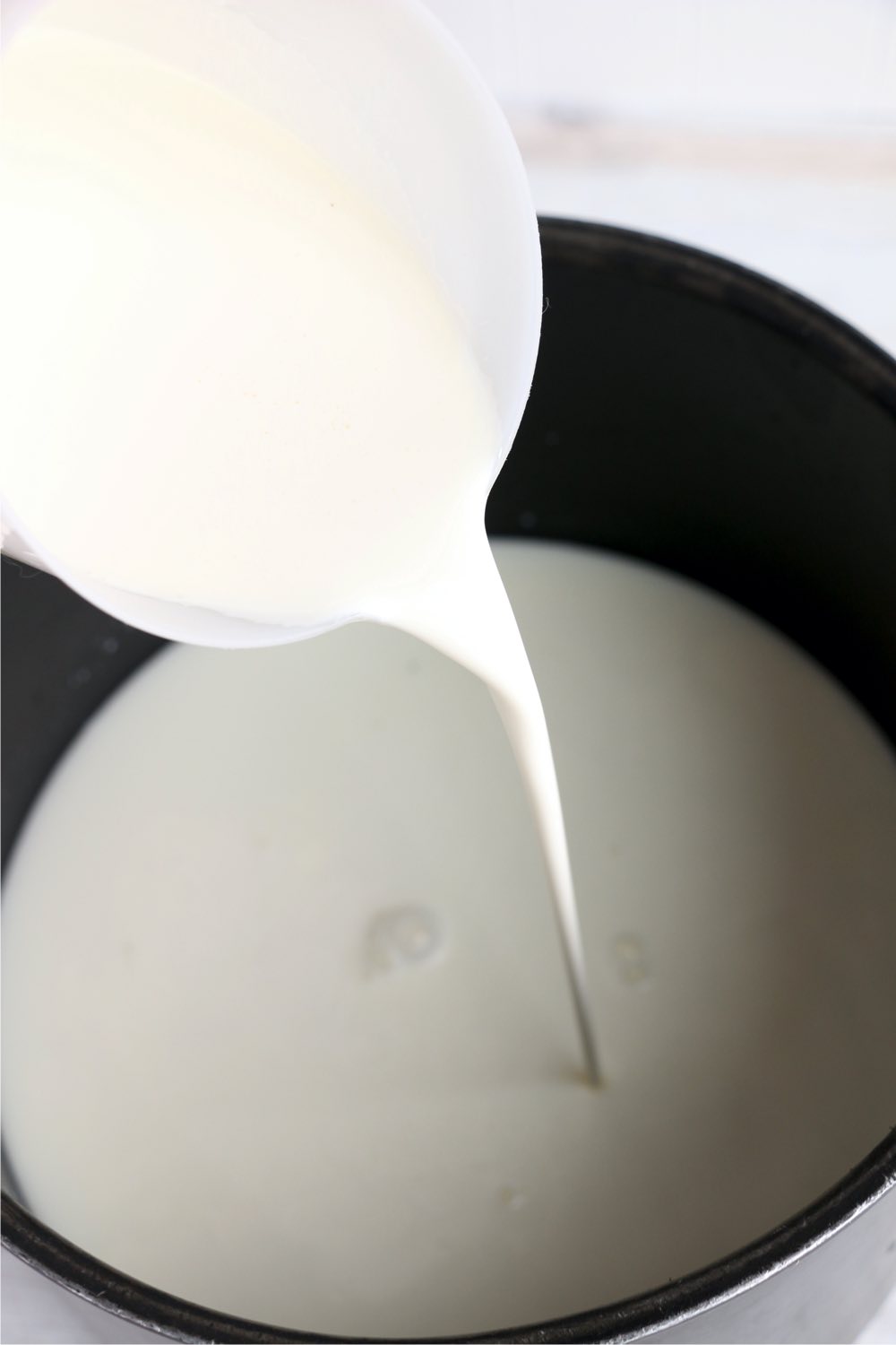 pouring milk into a stock pot
