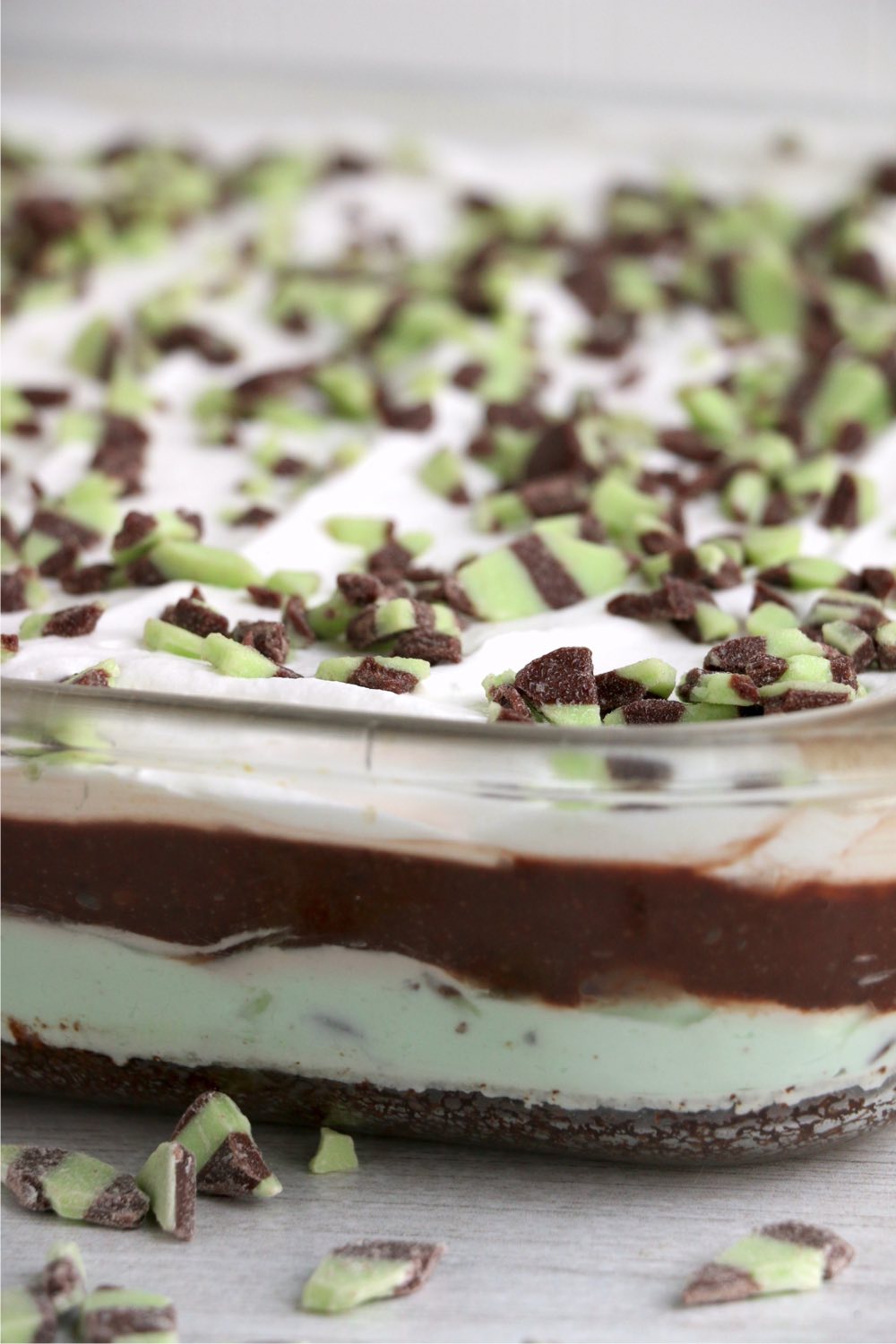 mint chocolate lush layered dessert in glass pan