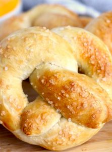 soft pretzels in front of cheese dip