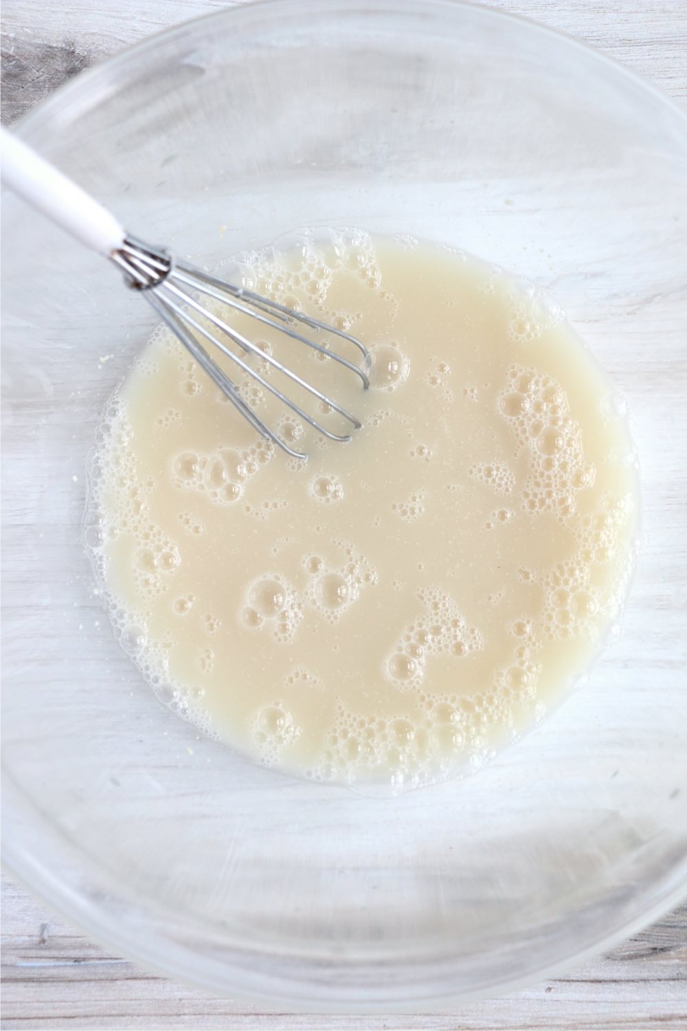 whisking yeast with water