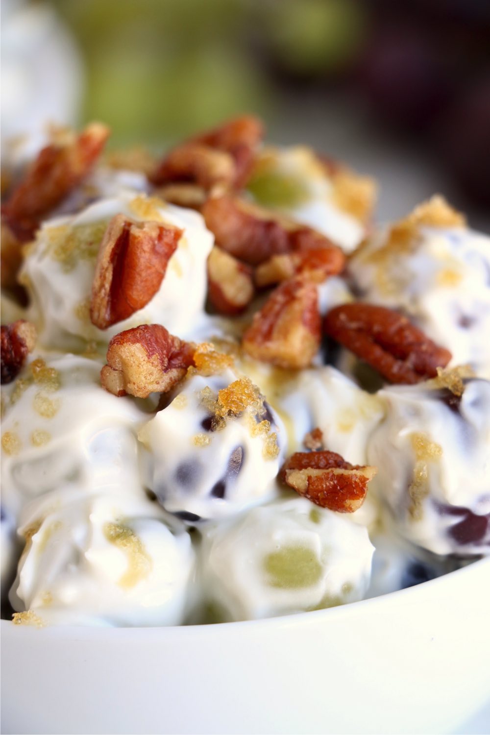 up close shot of toasted pecans on grape salad