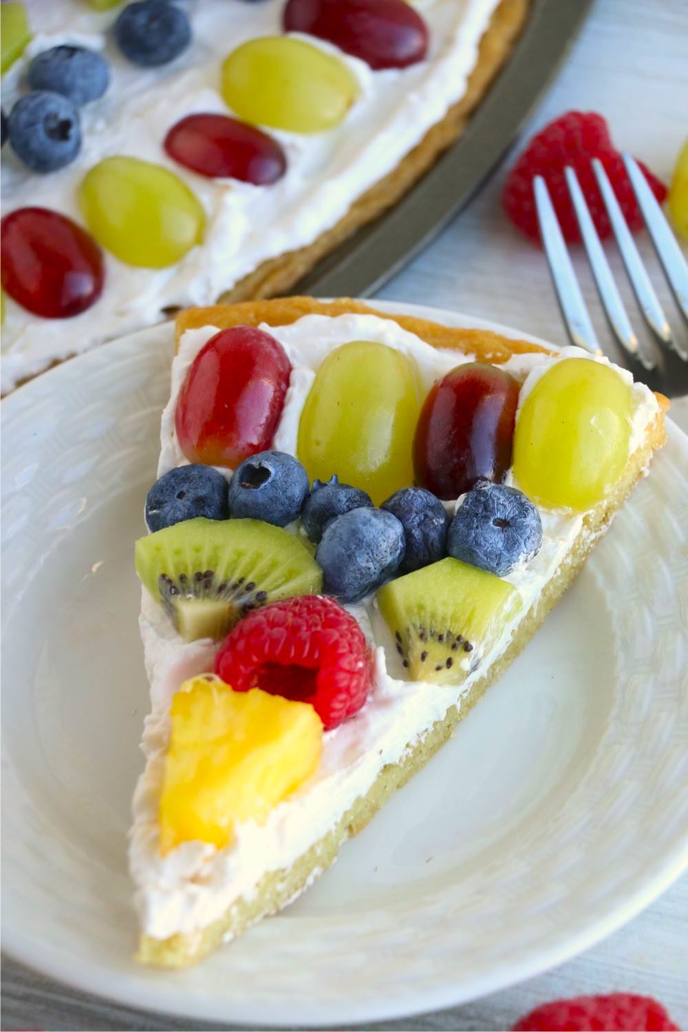 top shot of slice of fruit pizza on a plate