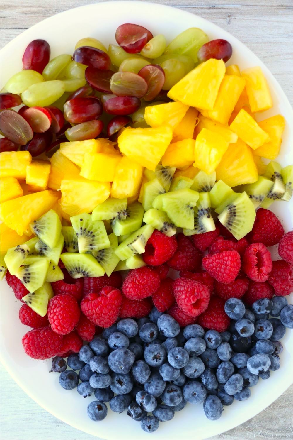 platter of cut fresh fruit