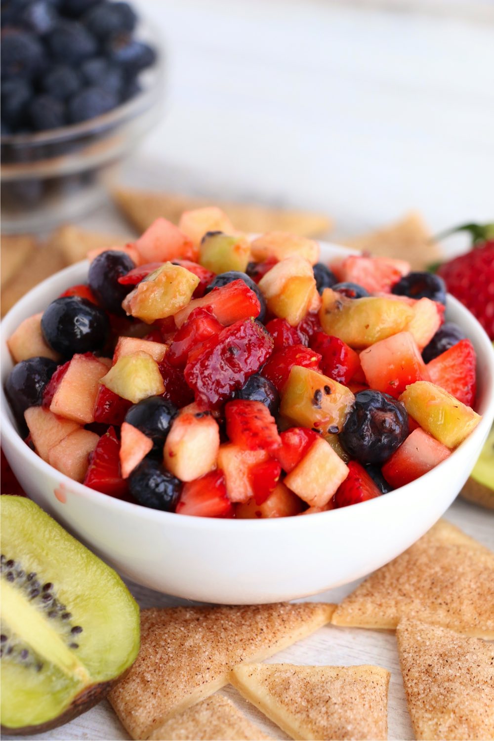 White bowl filled with mixed fruit
