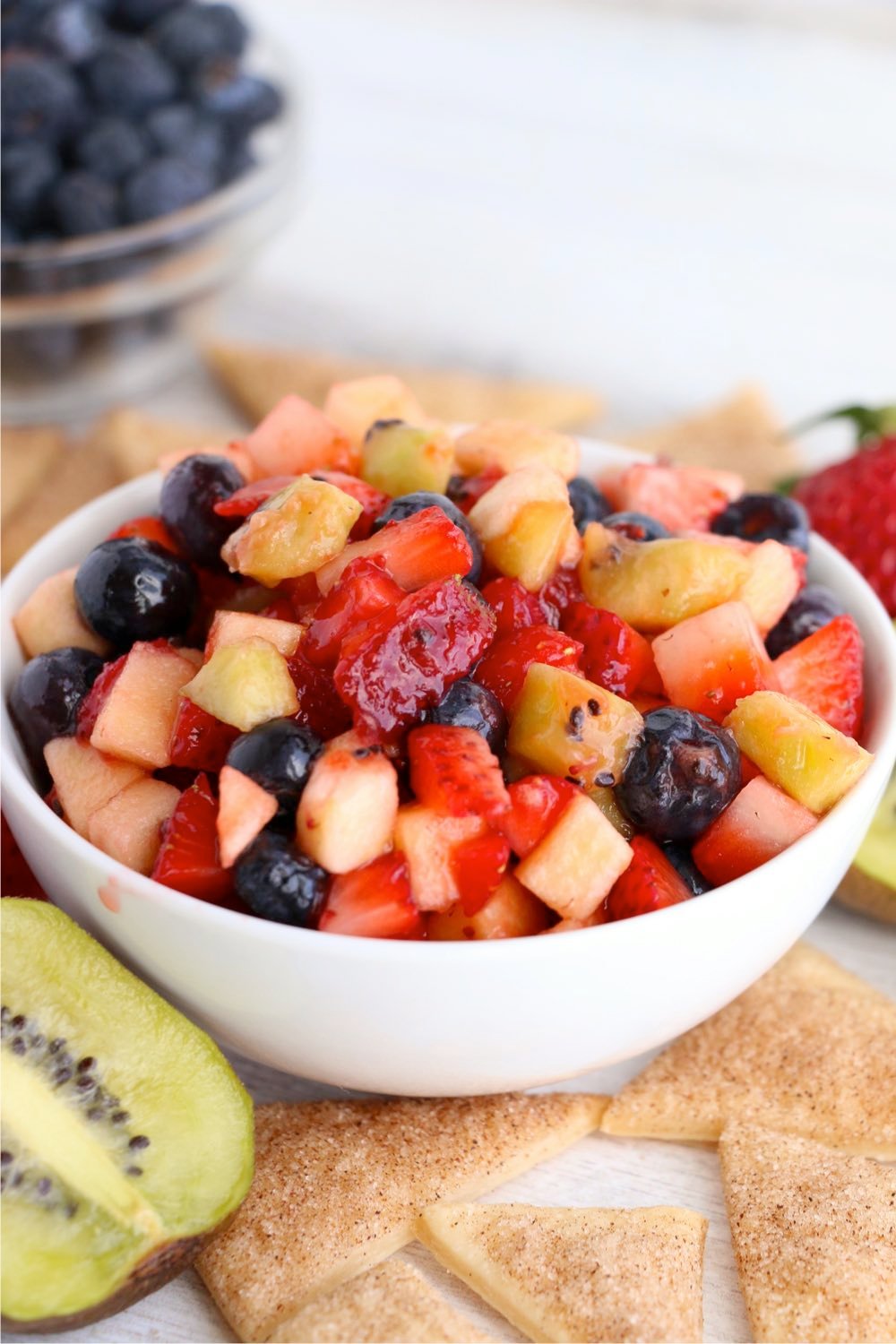 White bowl filled with mixed fruit