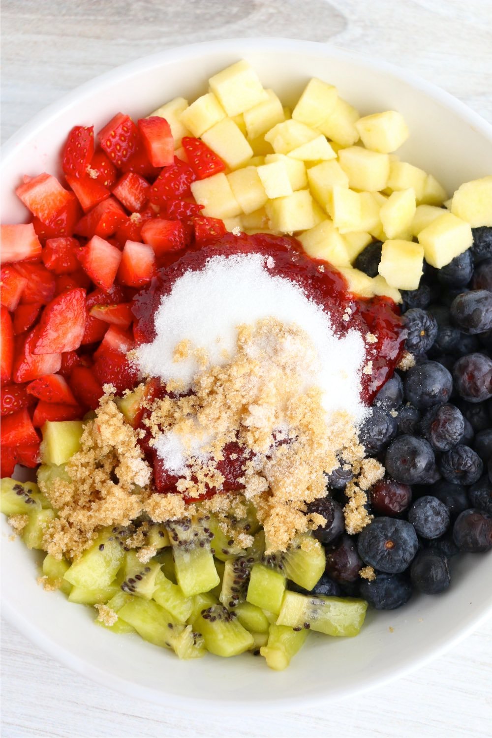 fruit in bowl with sugar and jam