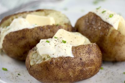 Baked potatoes with butter and sour cream