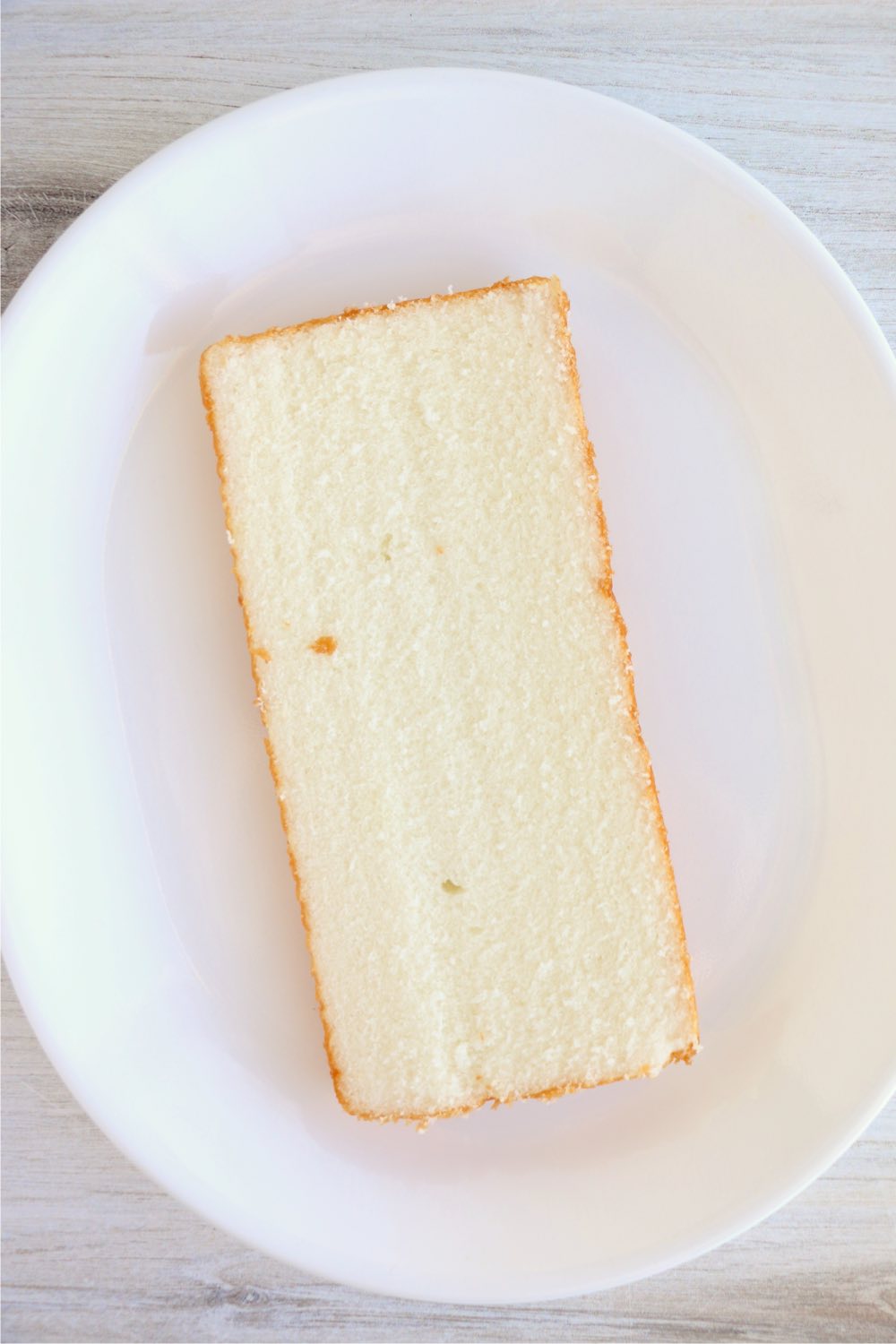layer of pound cake on white plate